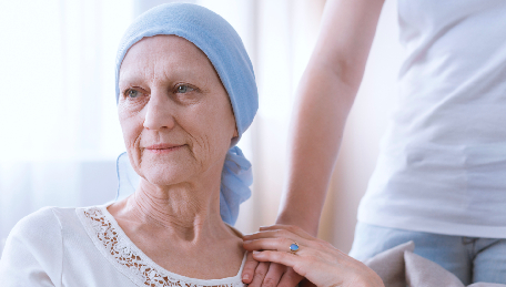 Woman wearing blue headscarf getting support