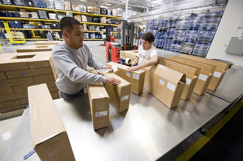 Workers unboxing and inspecting filters